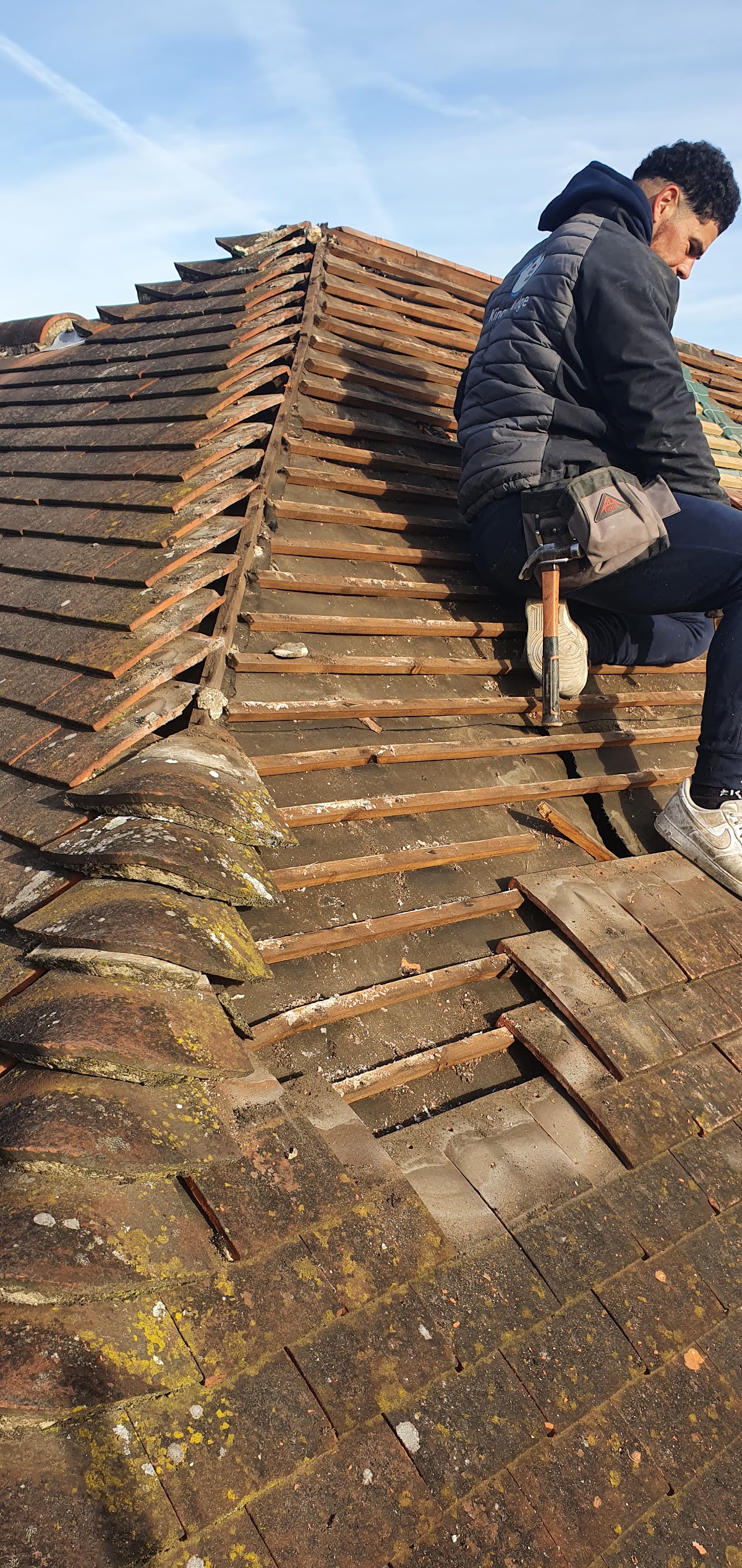 Roofer working on roof battens